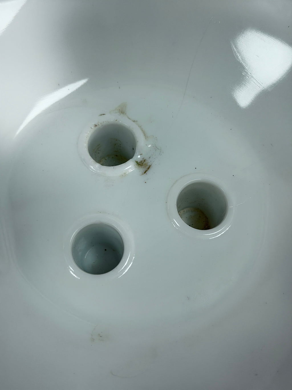 Milk glass epergne base underside with three circular openings