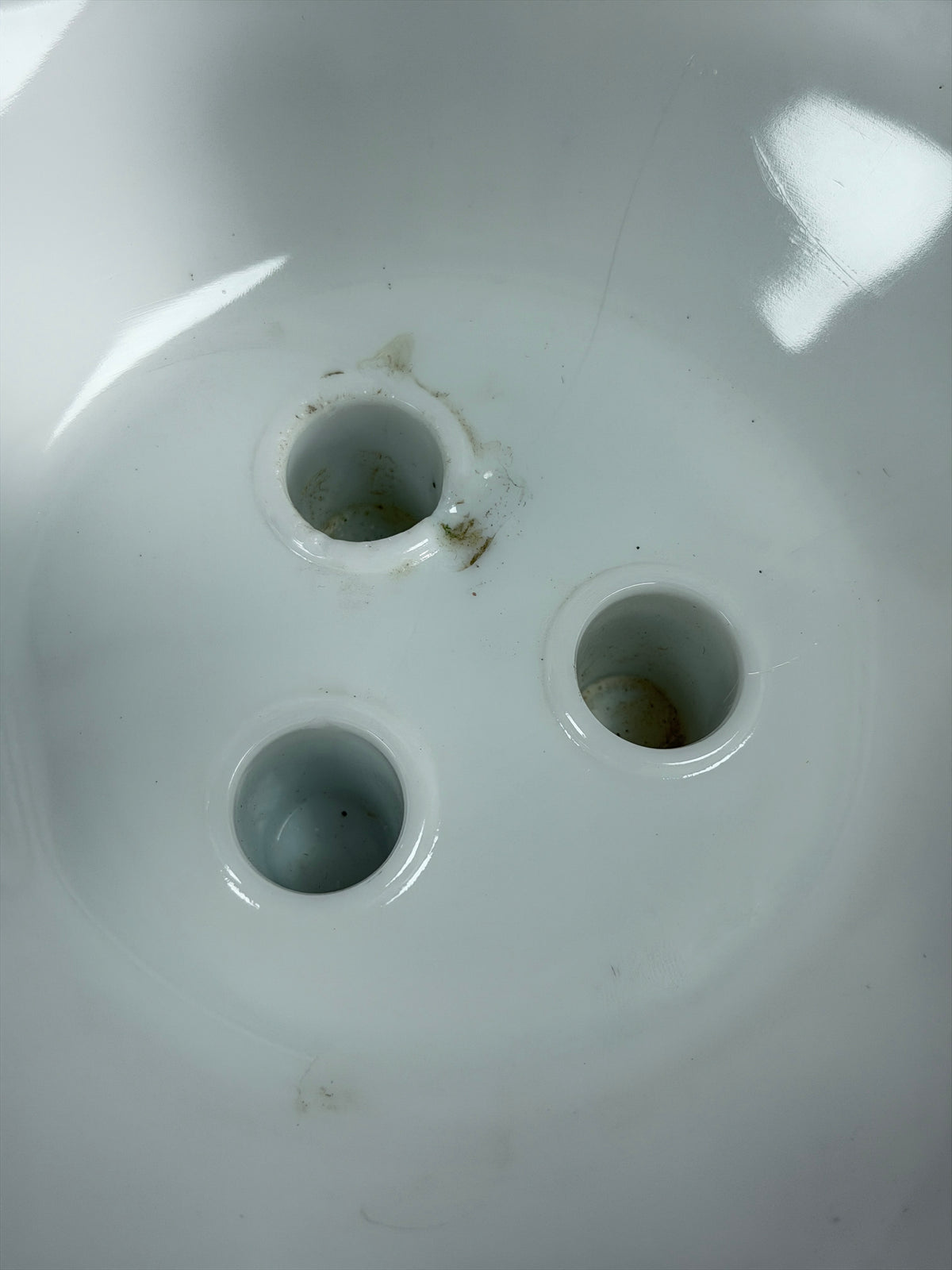 Milk glass epergne base underside with three circular openings