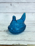 Blue glass hen on nest covered candy dish, full figure view