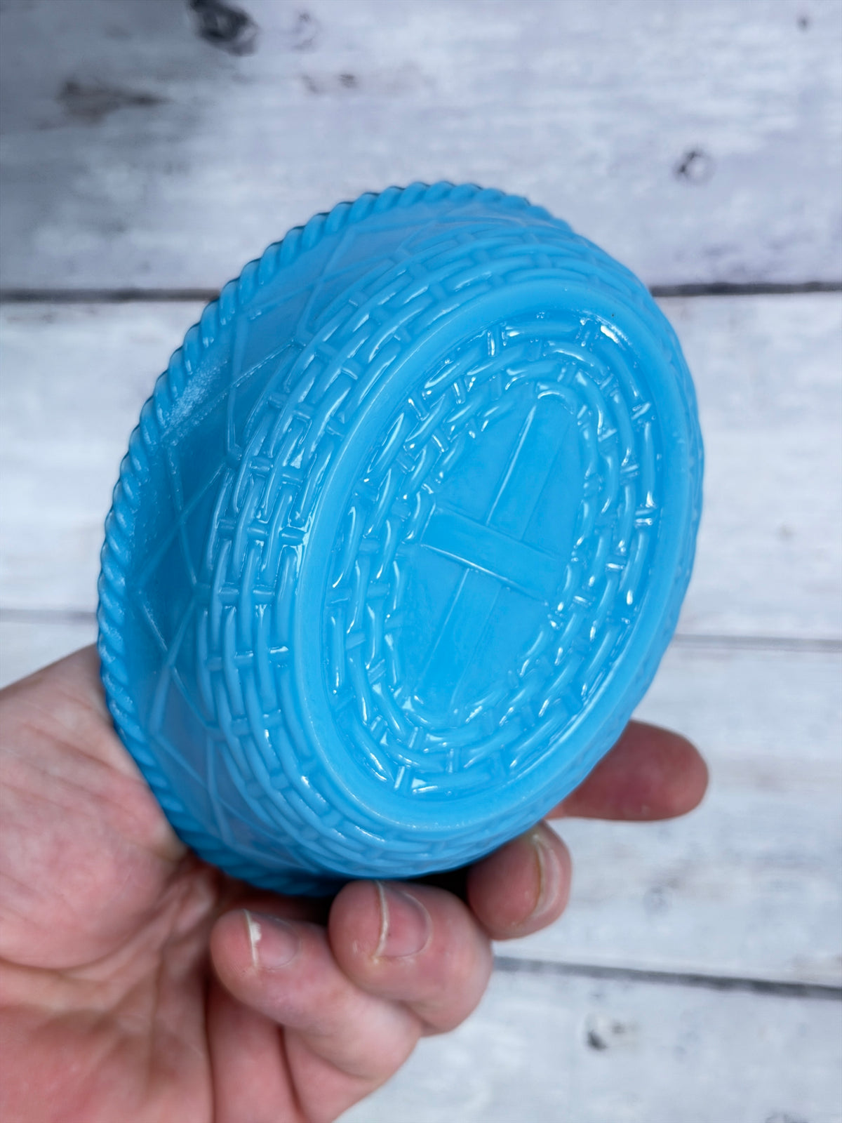 Blue slag glass covered dish lid with embossed oval pattern on side
