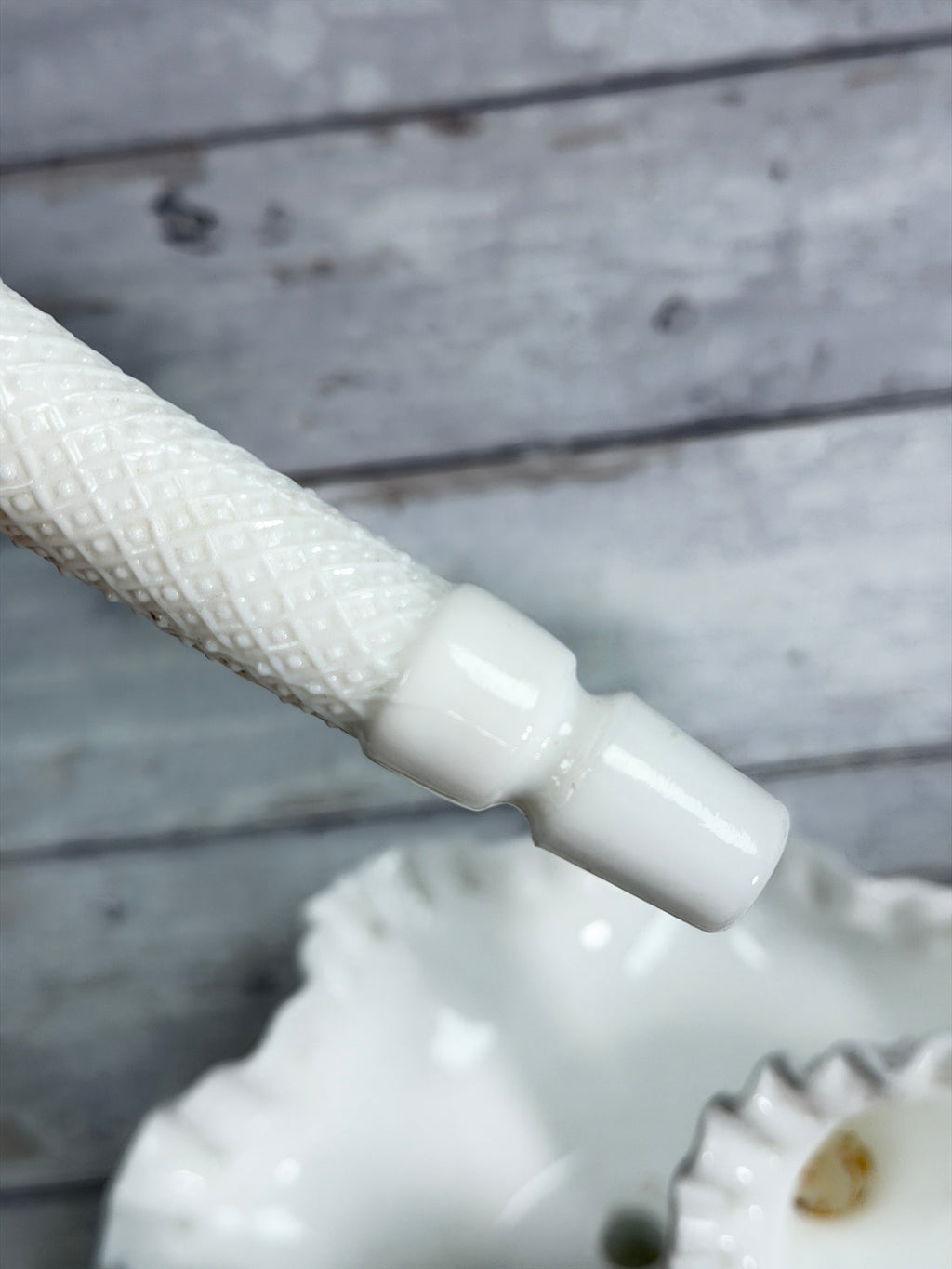 Milk glass epergne with diamond-lace texture and three prongs