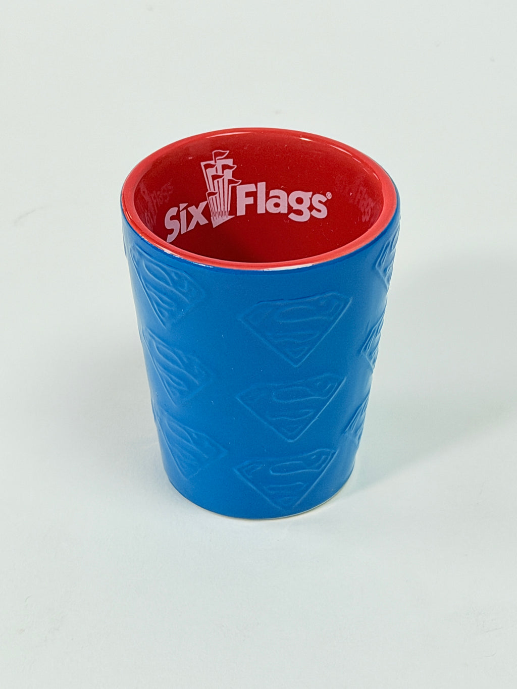 Six Flags Superman Ceramic Shot Glass Blue Red Embossed Logo