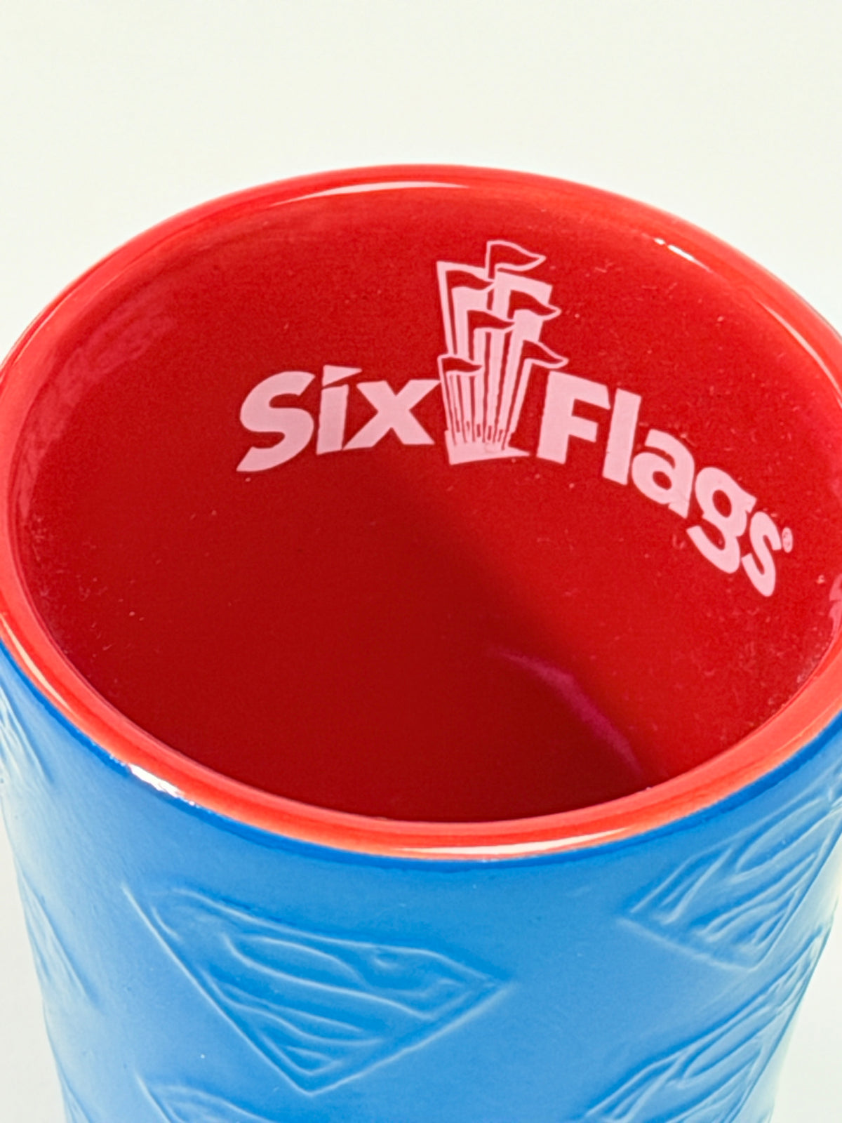 Six Flags Superman Ceramic Shot Glass Blue Red Embossed Logo