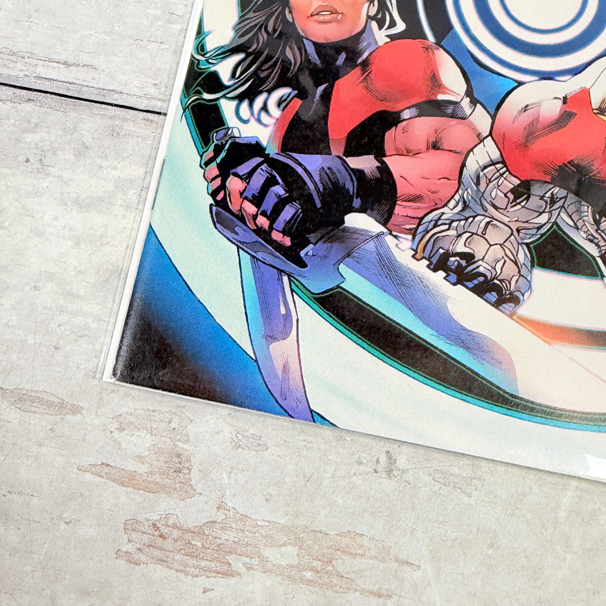 Astonishing X-Men #13 (2018), Greg Land regular cover: lower-left front detail of the actual pre-owned copy.