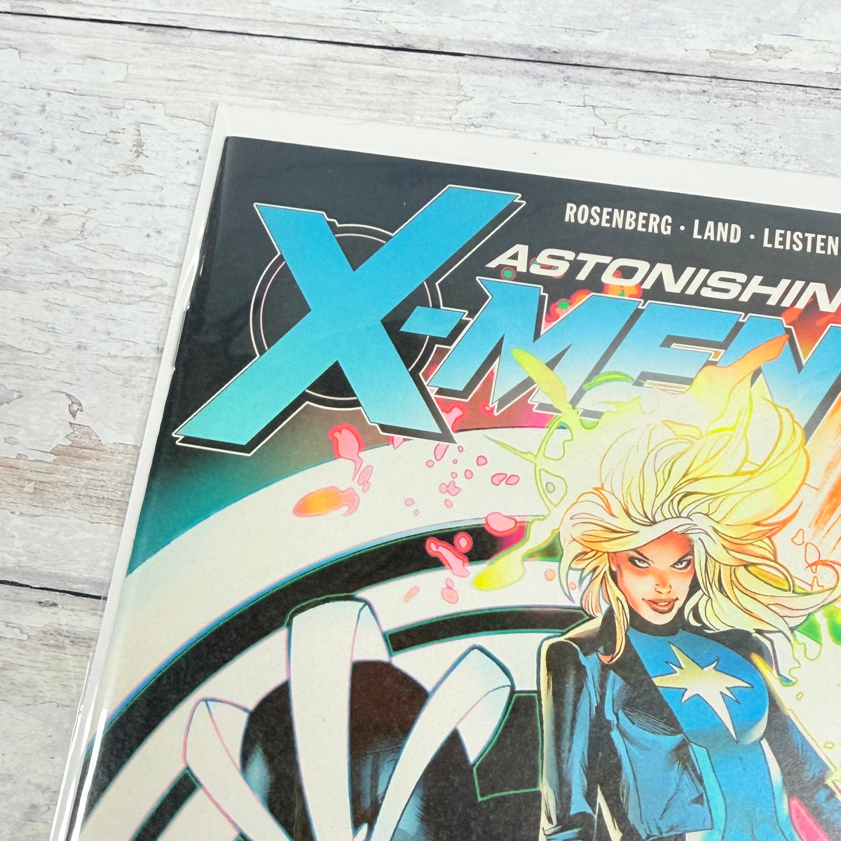 Astonishing X-Men #13 (2018), Greg Land regular cover: upper-left front detail of the actual pre-owned copy.