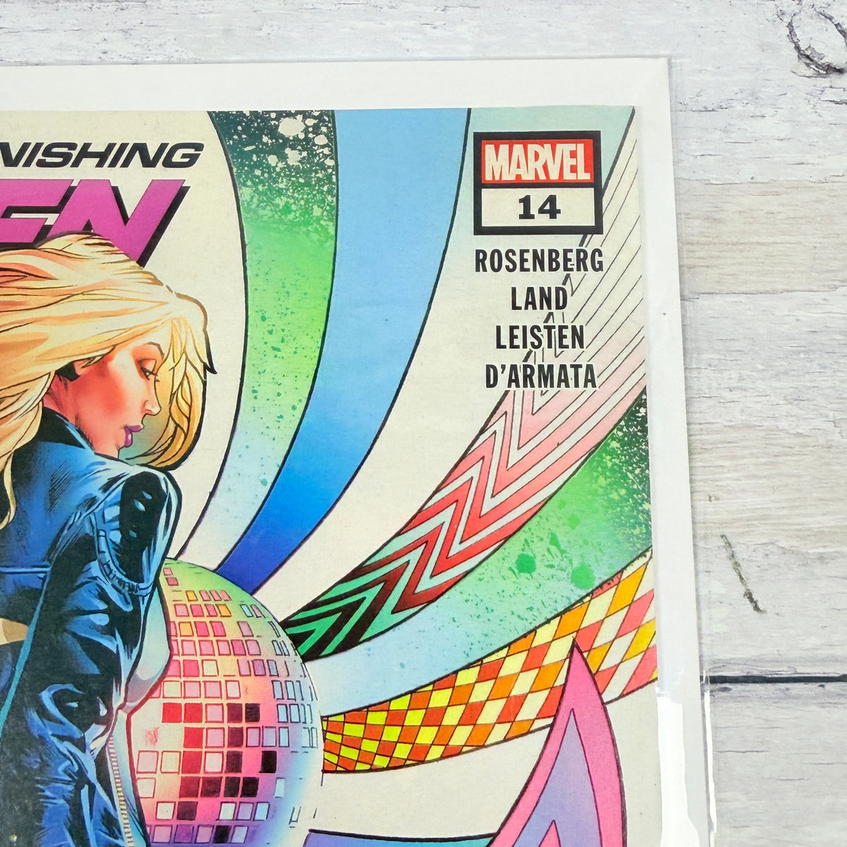 Astonishing X-Men #14 (2018), Greg Land regular cover: upper-right front detail of the actual pre-owned copy.