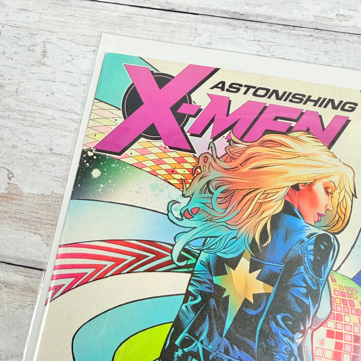 Astonishing X-Men #14 (2018), Greg Land regular cover: upper-left front detail of the actual pre-owned copy.