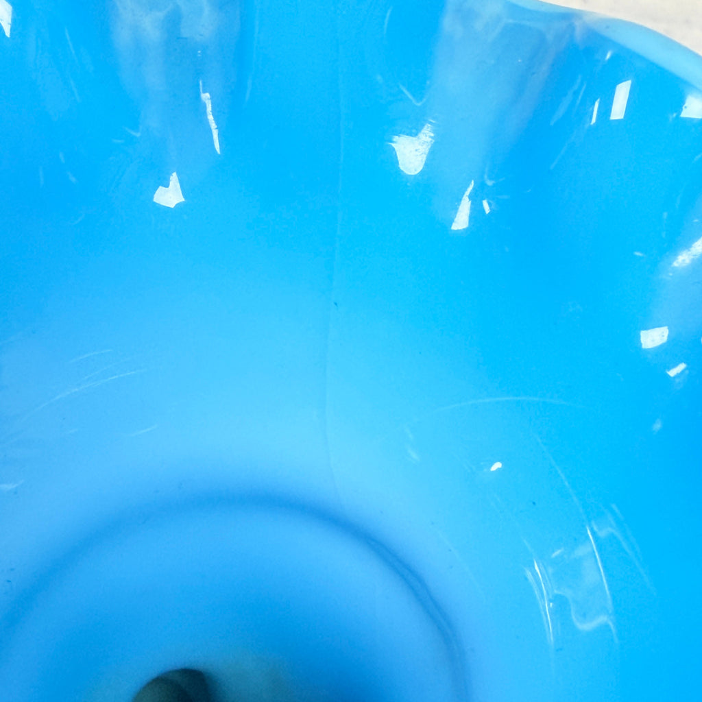 Interior view of blue glass vase showing the hairline crack