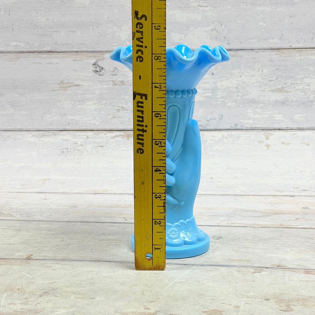 Blue glass hand vase beside ruler showing approximate eight-inch height