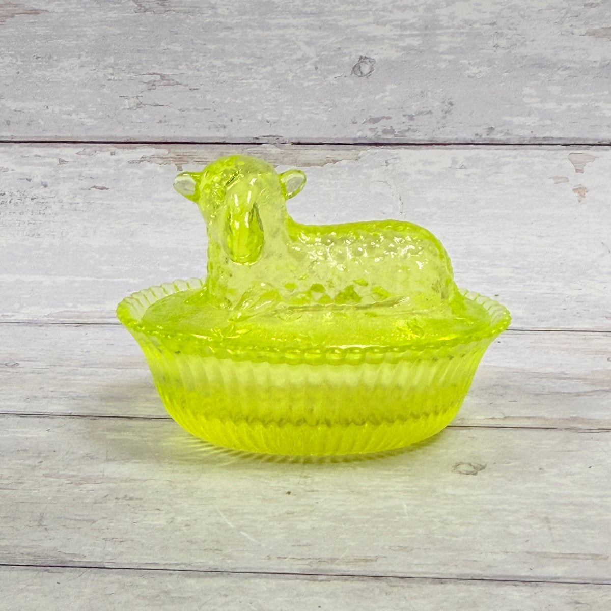 Boyd vaseline glass lamb on nest covered dish, front view