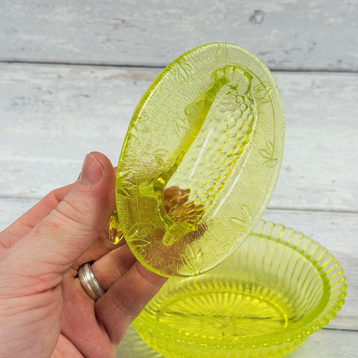 Underside of Boyd vaseline glass lamb cover showing Boyd mark