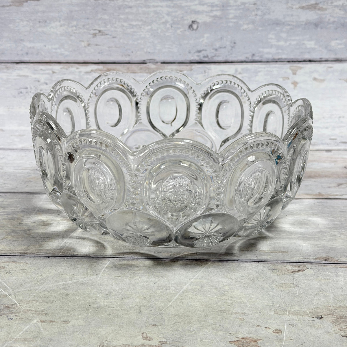 Clear Moon and Star glass bowl with scalloped rim, oval moon panels, and star details