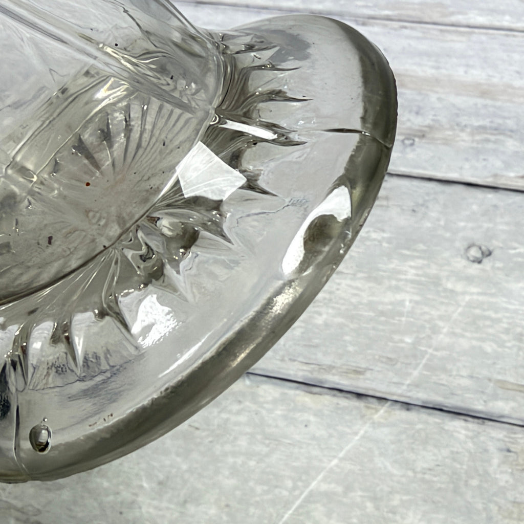 Close-up of the line across the glass foot and visible interior residue