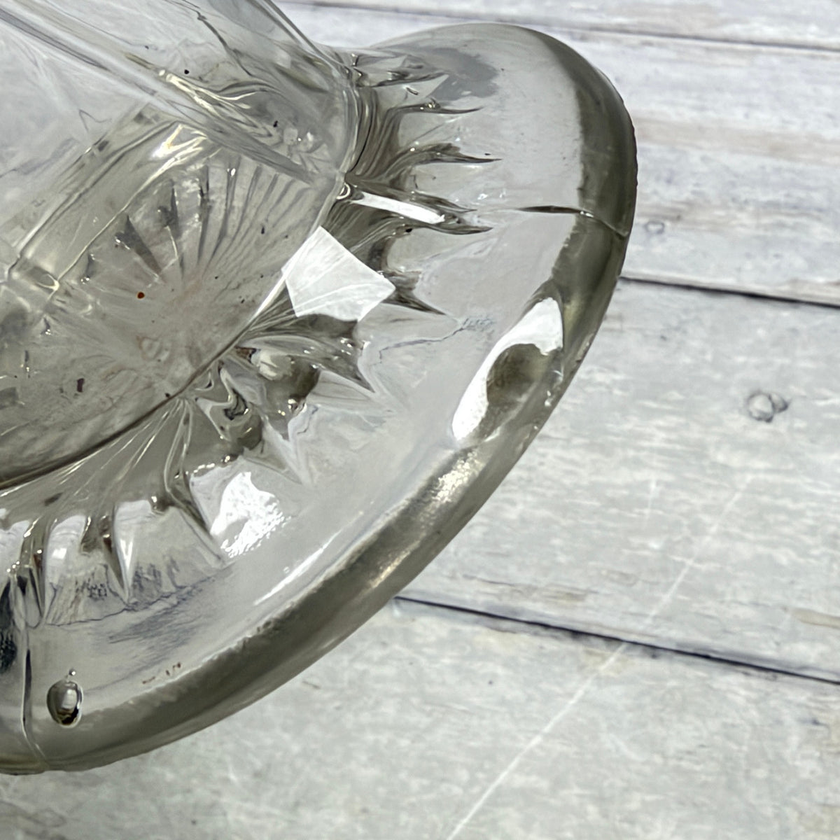 Close-up of the line across the glass foot and visible interior residue