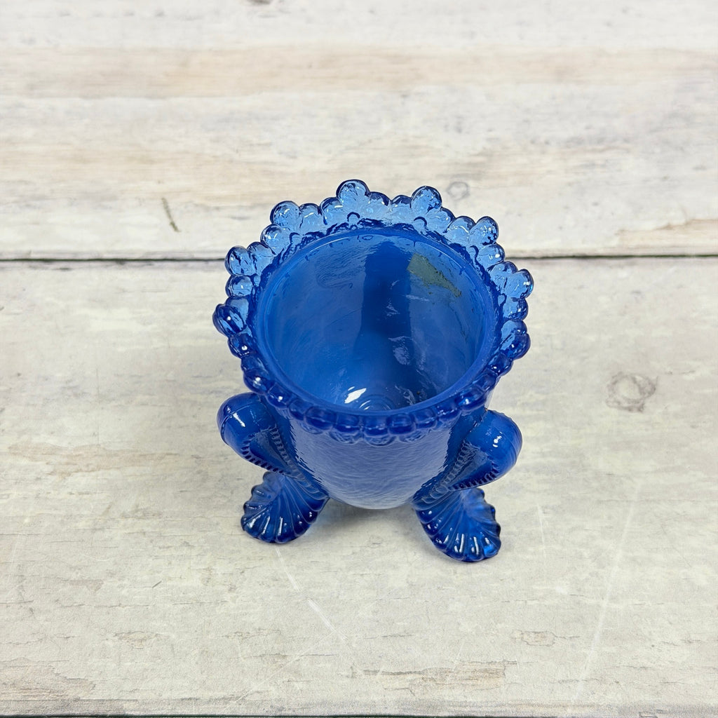 Angled top view of blue Degenhart Forget-Me-Not toothpick holder and floral rim