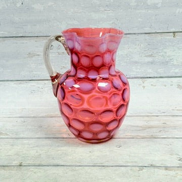 Fenton cranberry opalescent Coin Dot pitcher front view