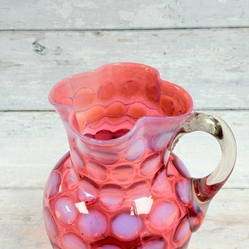 Scalloped pitcher mouth and applied clear handle