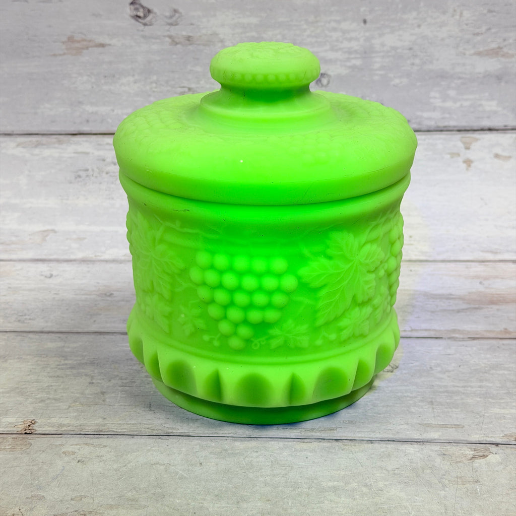 Front view of Fenton mint green satin Grape and Cable tobacco jar with matching lid
