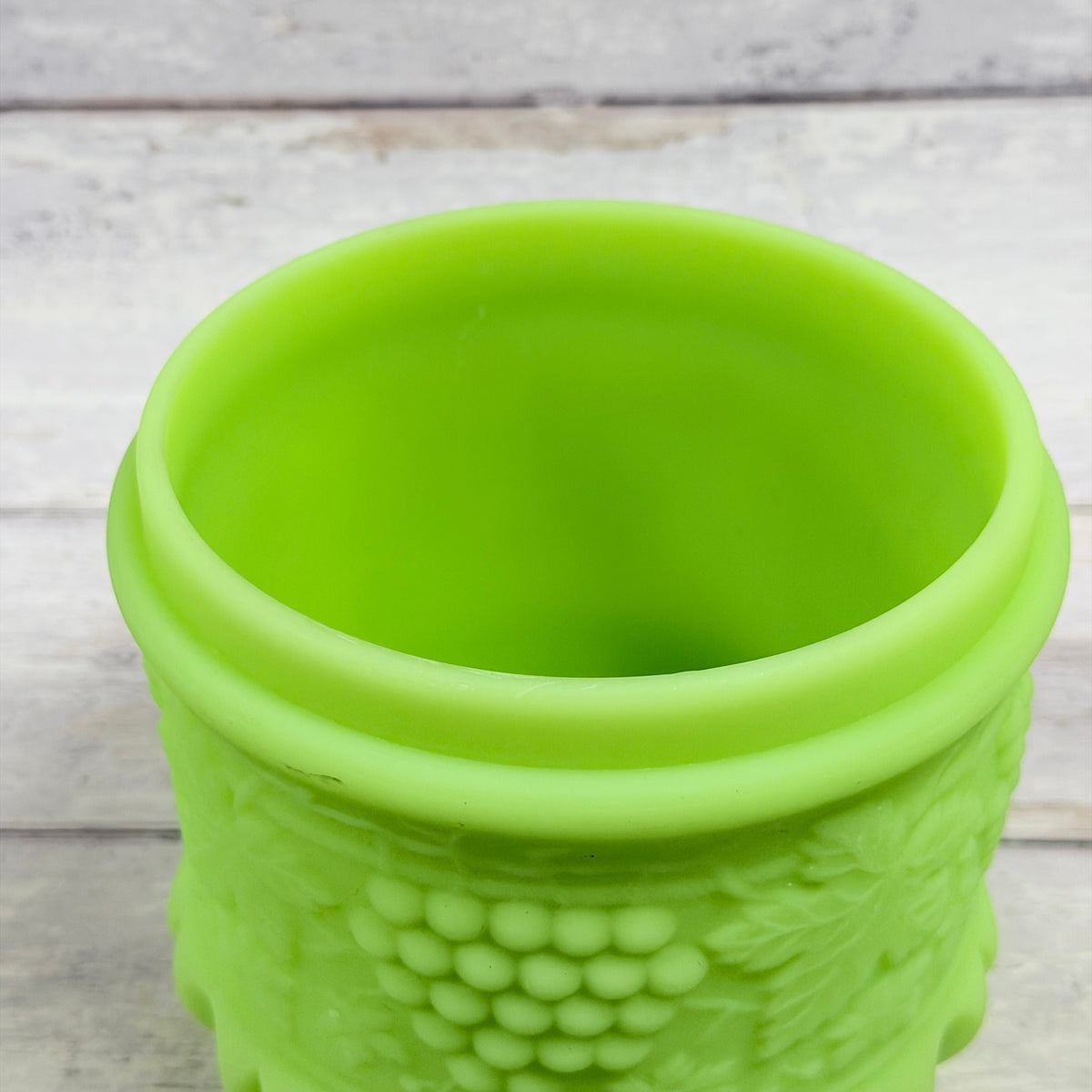 Open jar showing interior, rim and grape relief on Fenton satin glass tobacco jar