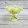 Fenton custard uranium glass pedestal compote with ruffled rim and hand-painted white daisies