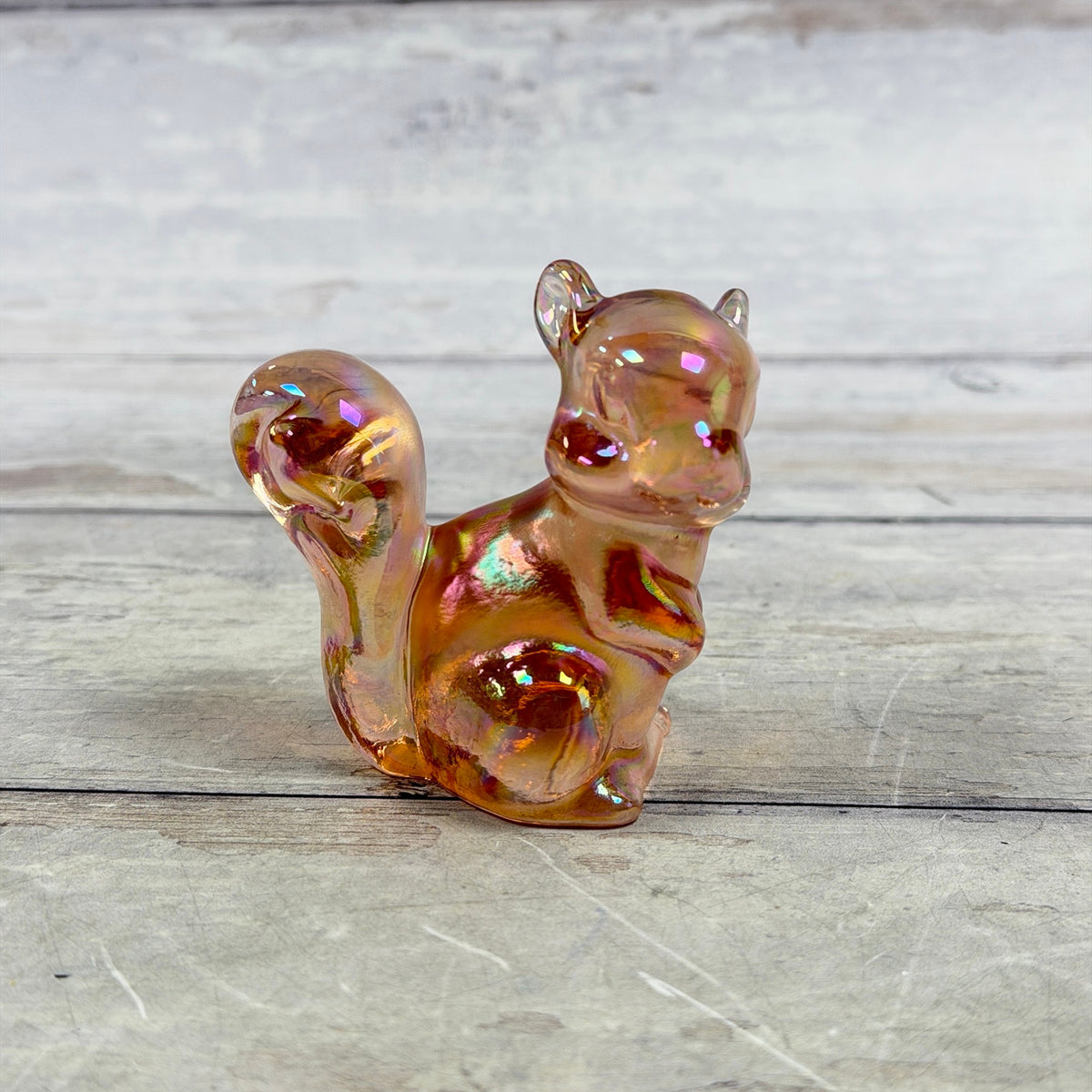 Fenton pink iridescent glass squirrel figurine, side view