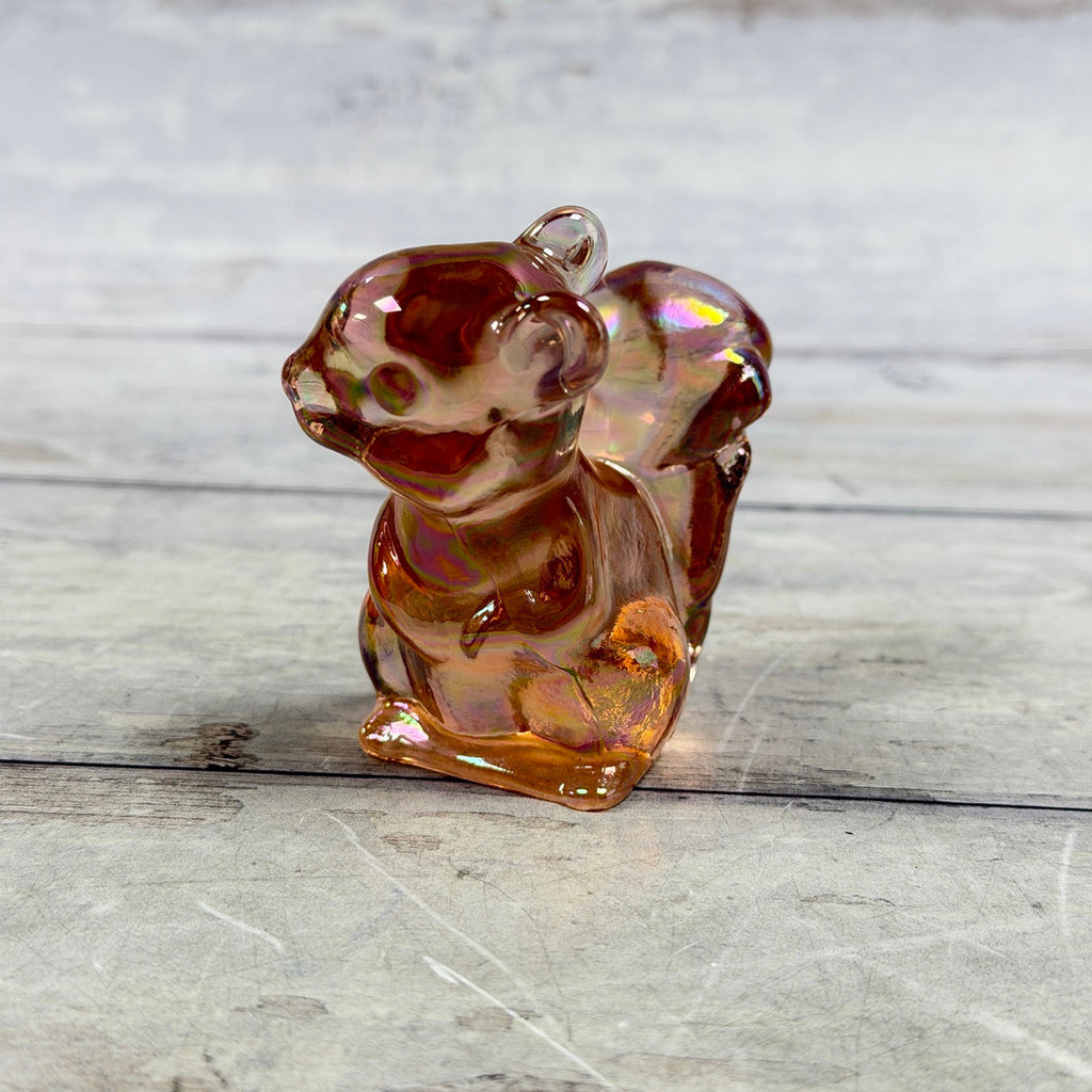 Fenton pink iridescent glass squirrel figurine, front view