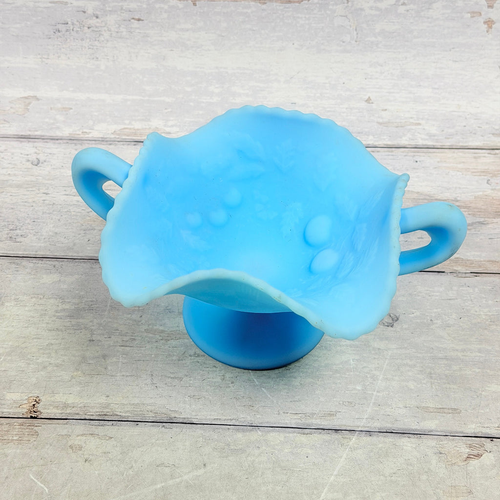 Fruit and foliage relief inside Fenton Blue Satin Three Fruits compote