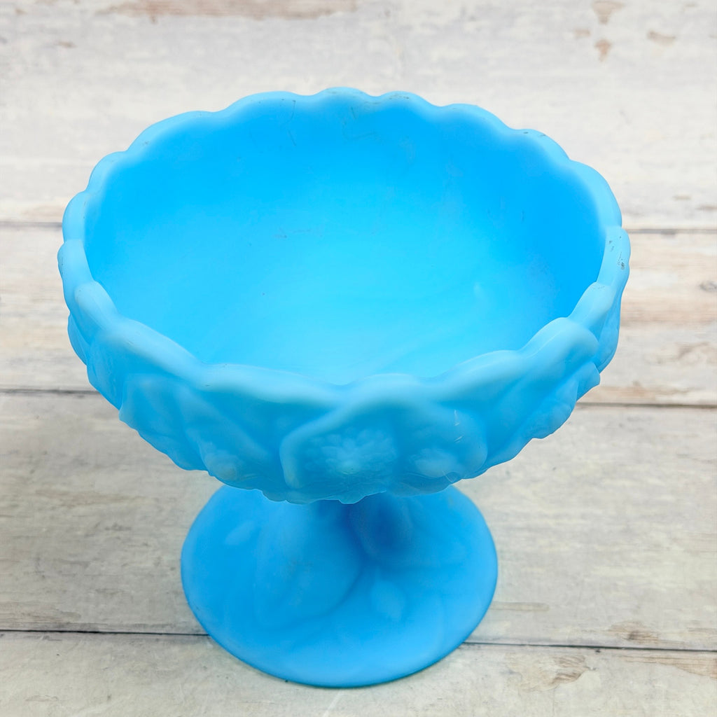 Interior of Fenton Blue Satin Water Lily compote showing visible surface scuffs and rim marks