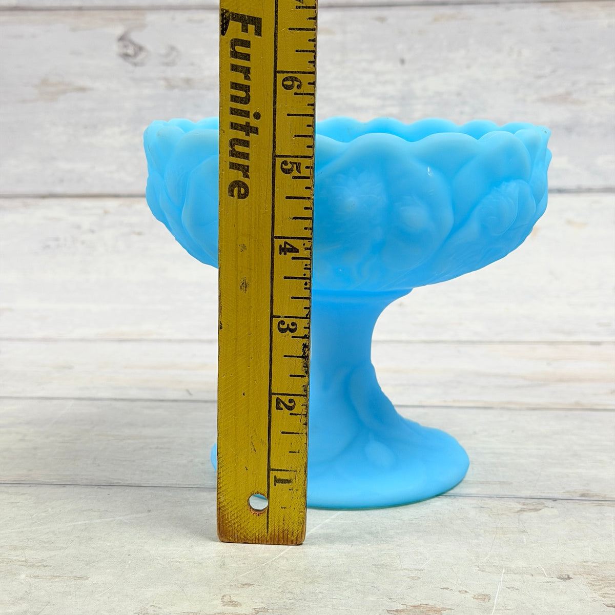 Fenton Blue Satin Water Lily compote beside ruler showing approximately five and a half inches in height