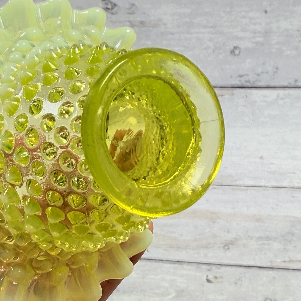 Underside of Fenton topaz opalescent hobnail basket showing circular foot