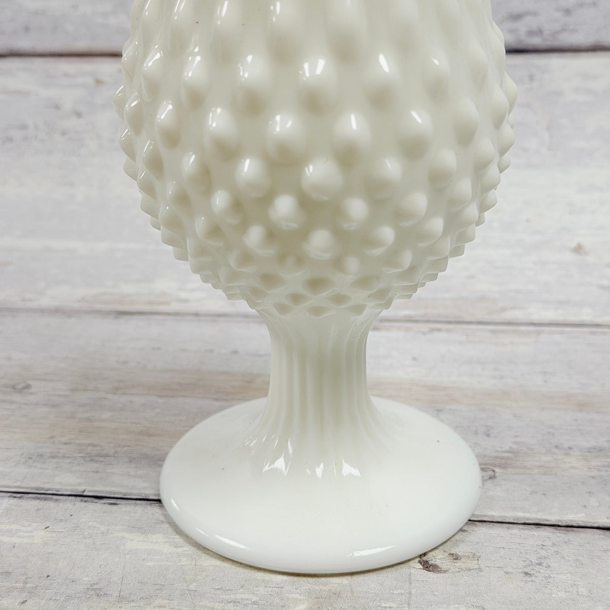 Hobnail texture and pedestal base of Fenton white milk glass swung vase