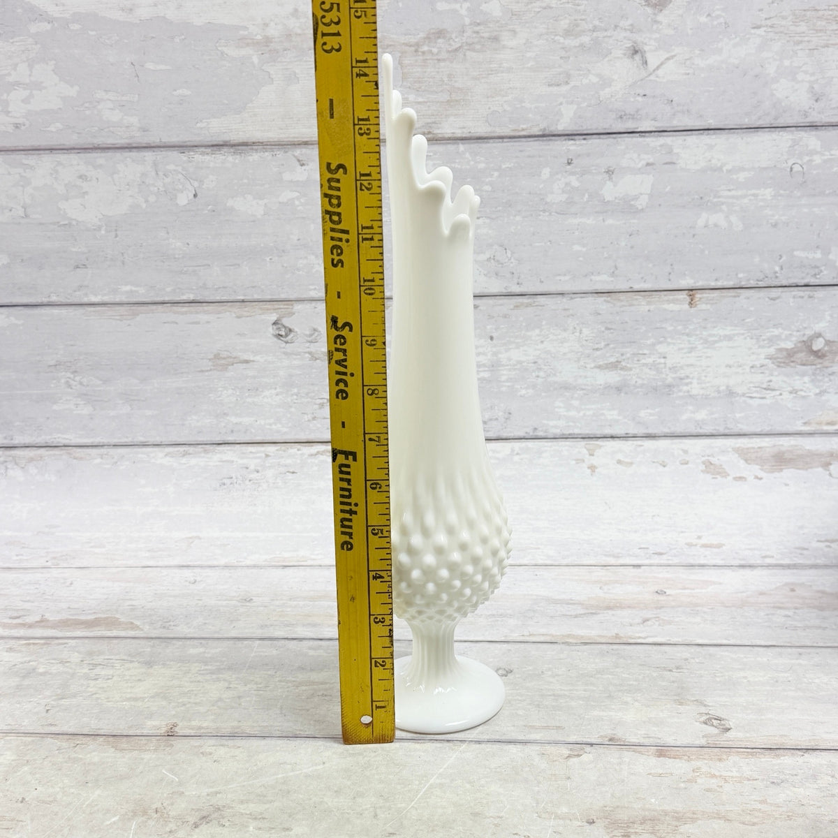 White hobnail swung vase beside ruler showing approximate fourteen-inch height