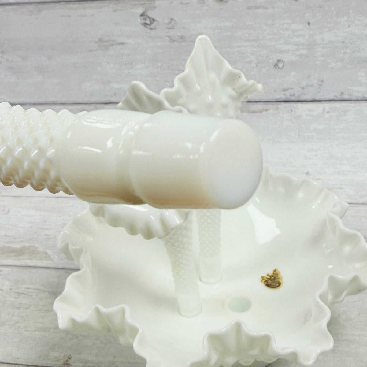 Close-up of second removable glass horn peg on milk glass epergne