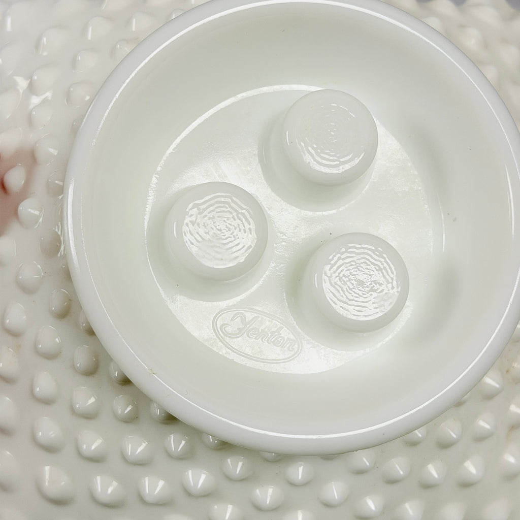 Underside of hobnail epergne bowl showing molded oval Fenton mark
