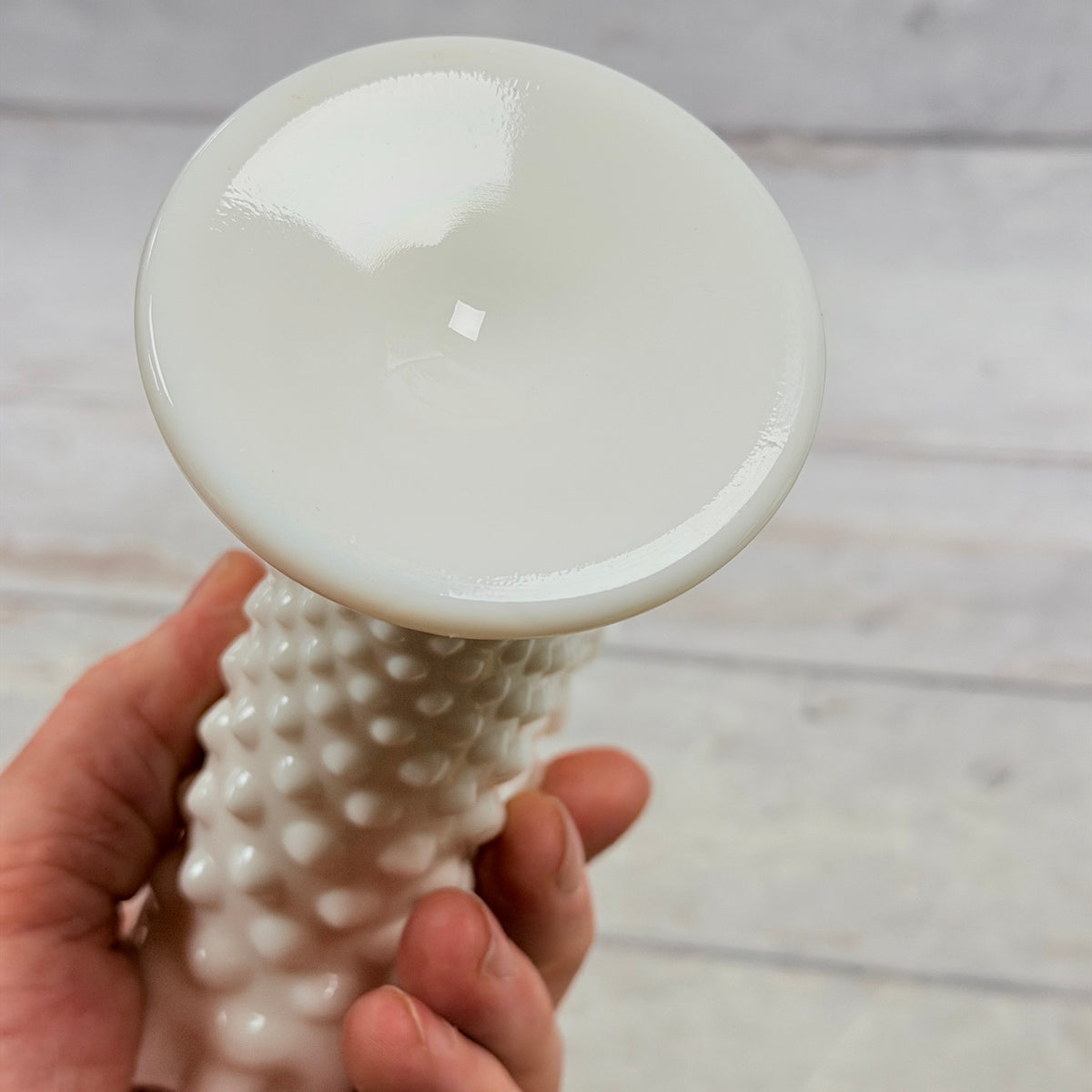 Underside of white milk glass fan vase foot