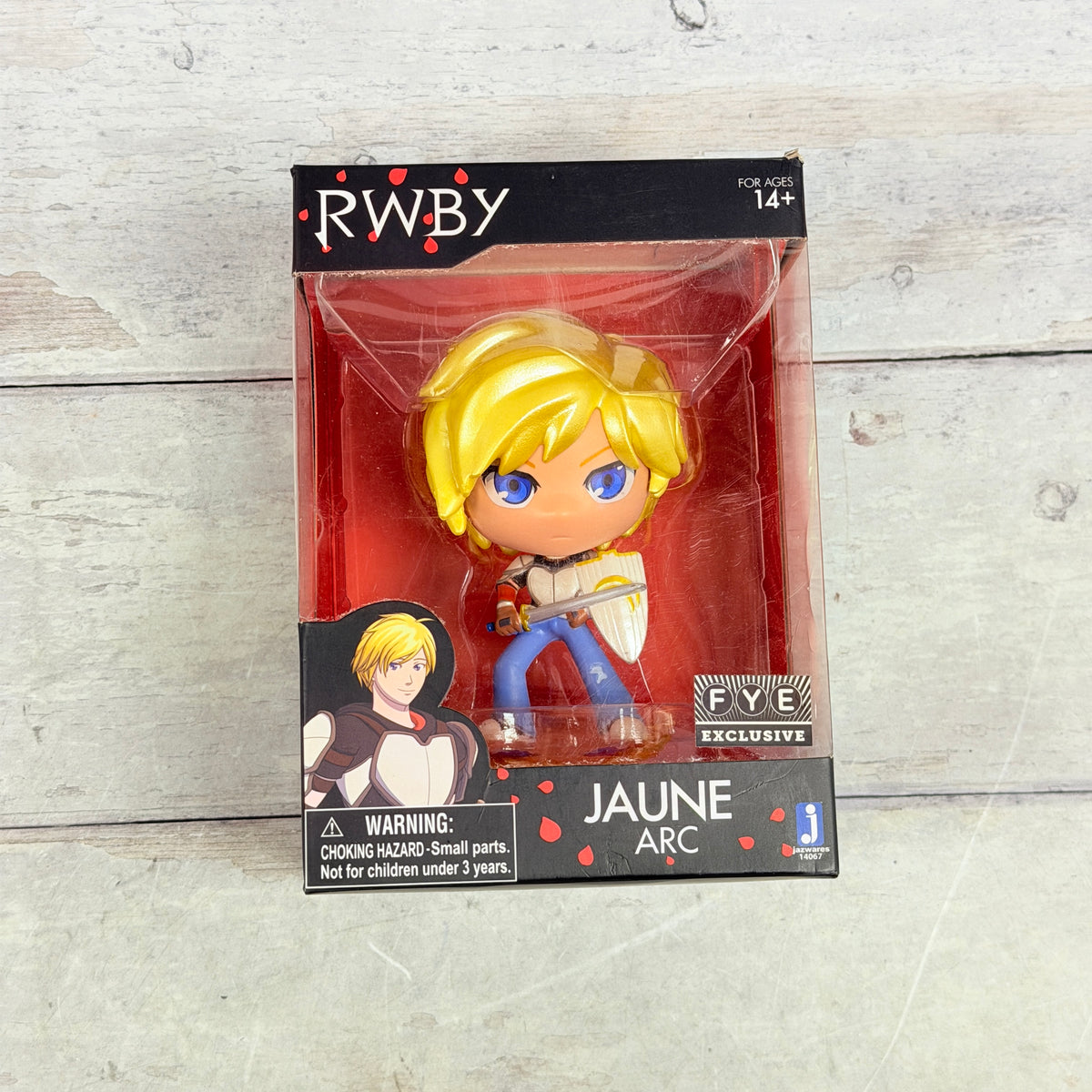 Jazwares RWBY Jaune Arc Vinyl Figure FYE Exclusive, front of boxed figure and visible packaging