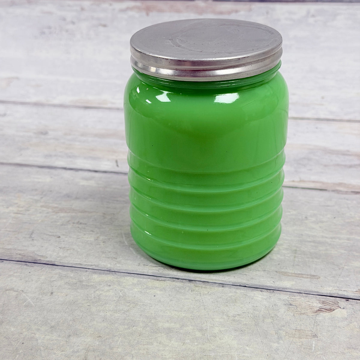 Back of Jeannette jadeite ribbed TEA canister J02 showing aluminum lid wear
