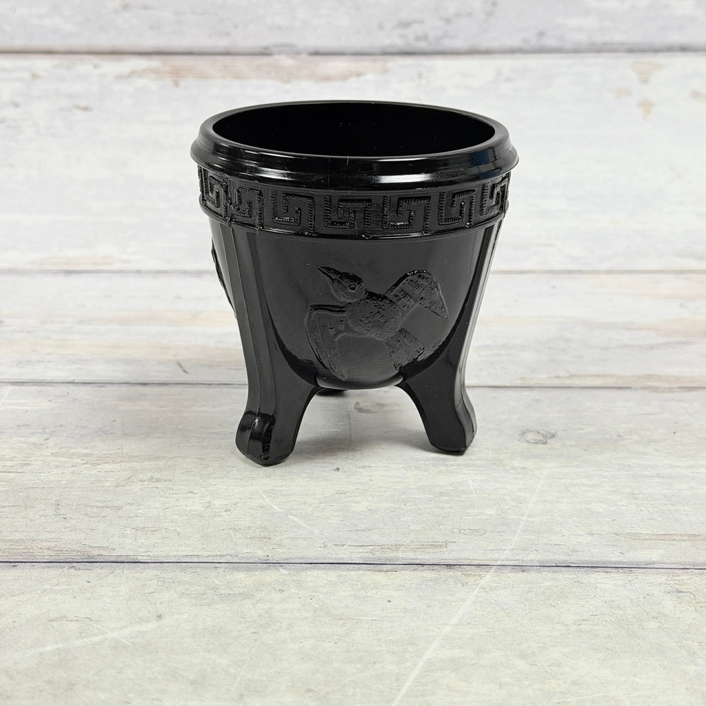 L.E. Smith black amethyst small three-footed glass bowl with raised bird motif and Greek Key rim