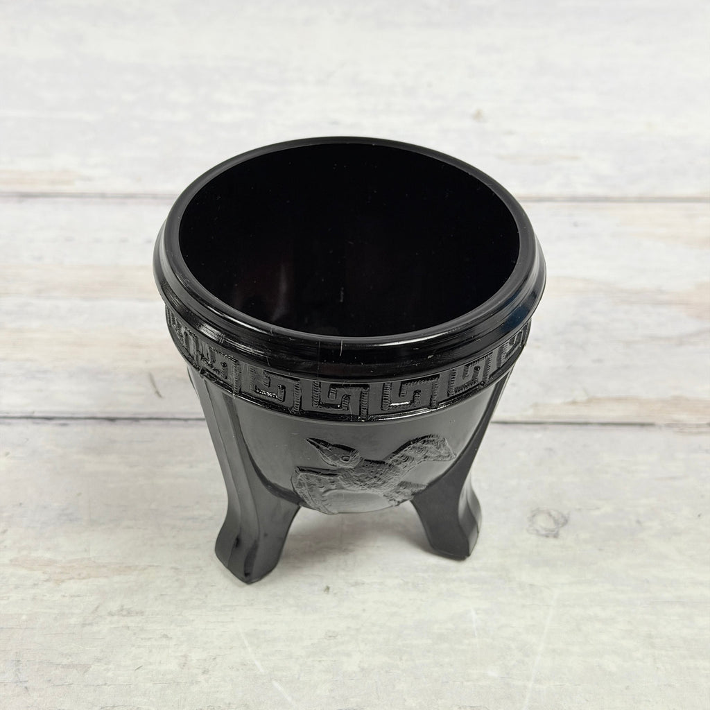 Upper view of black amethyst bird bowl showing interior and rim surface scratches