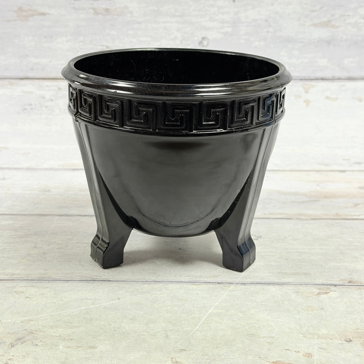 L.E. Smith black amethyst Greek Key three-footed fern bowl viewed from the side