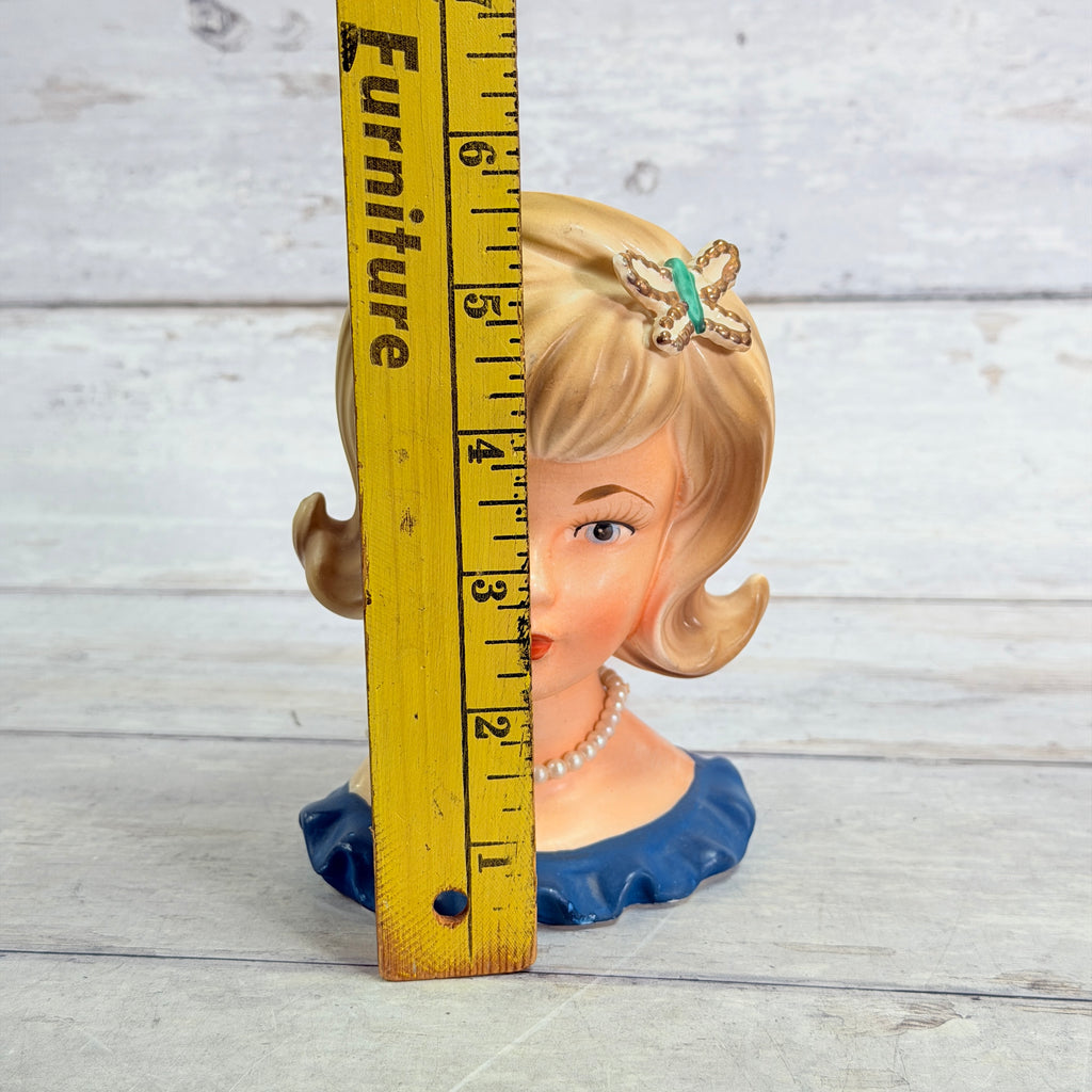 Lady head vase beside ruler showing approximately 5.5-inch height