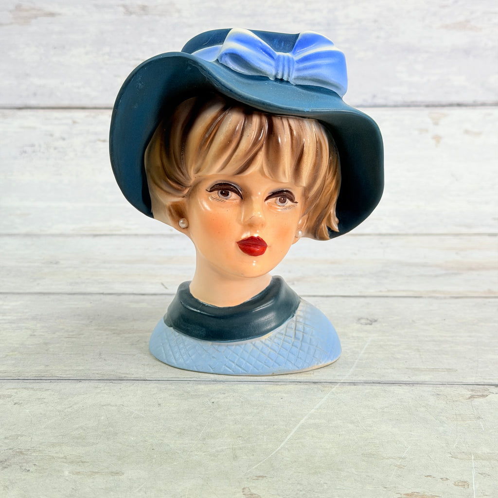 Napcoware lady head vase with blue bow hat and pale blue textured neckline