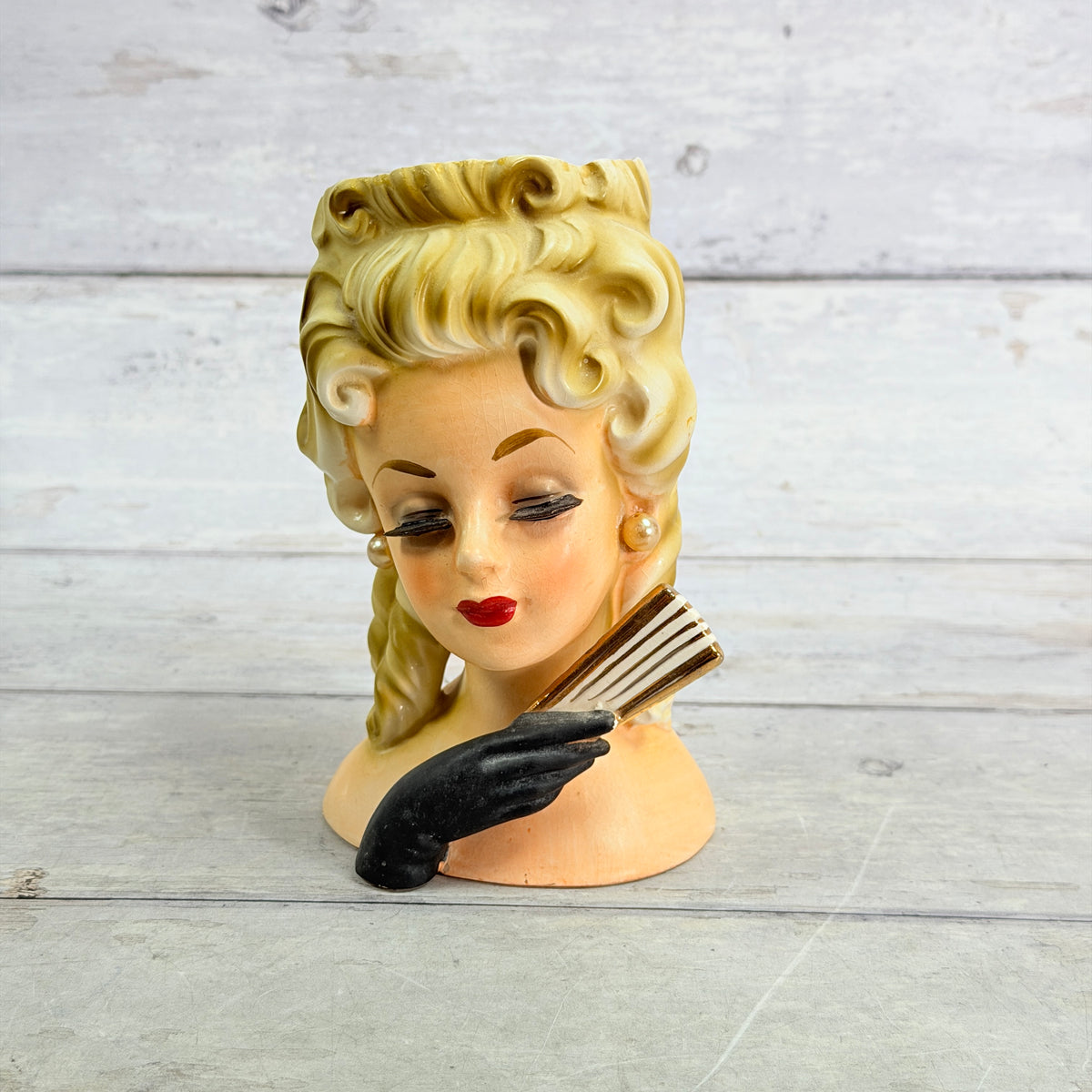 Inarco E1062 head vase with blonde ringlets, black gloved hand and striped fan