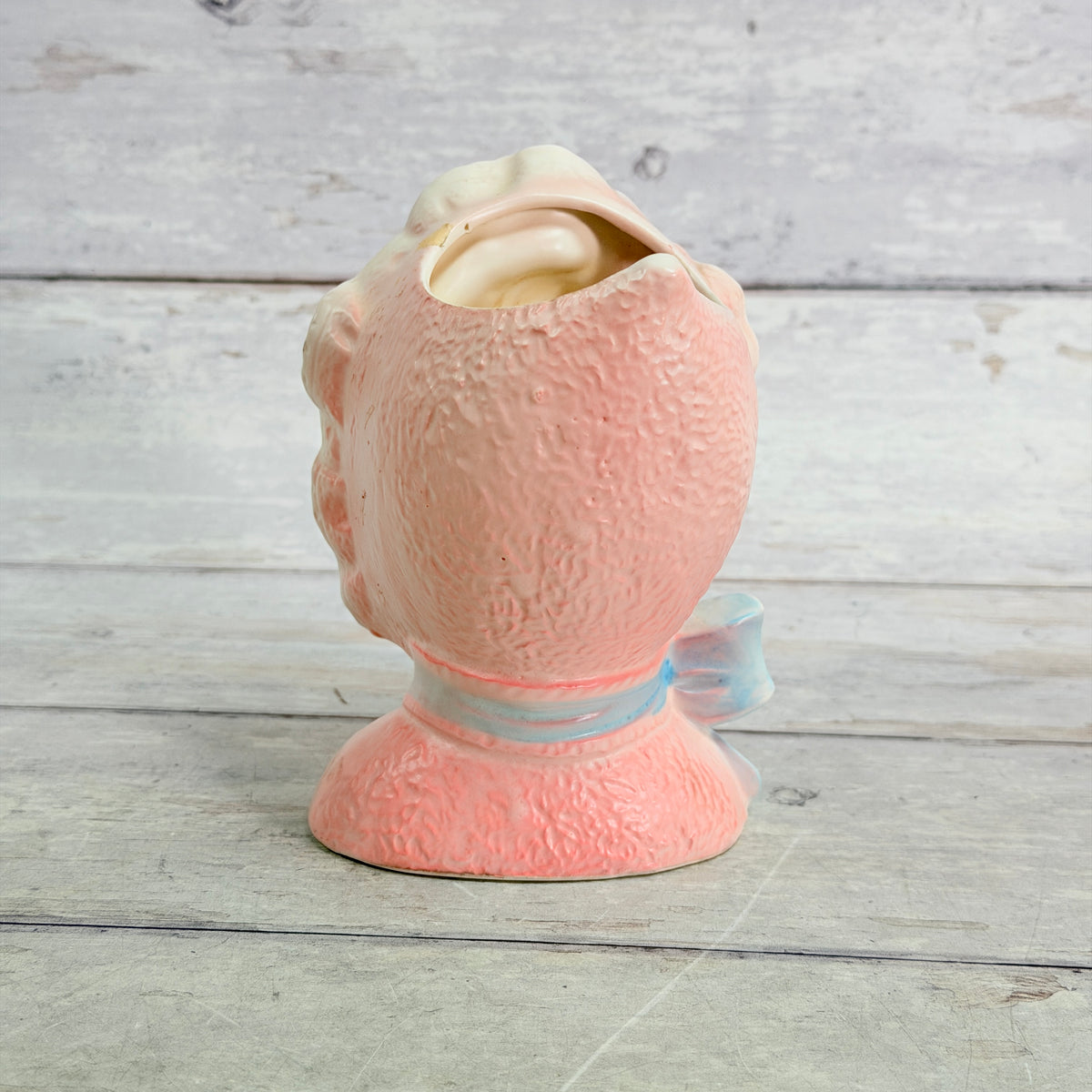 Rear view of textured pink bonnet