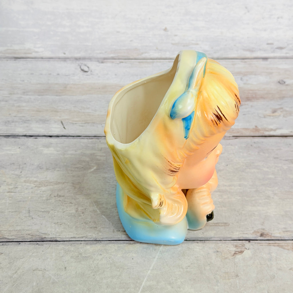 Side and top showing girl vase opening