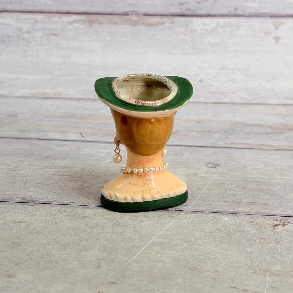 Rear showing crazing and worn hat opening