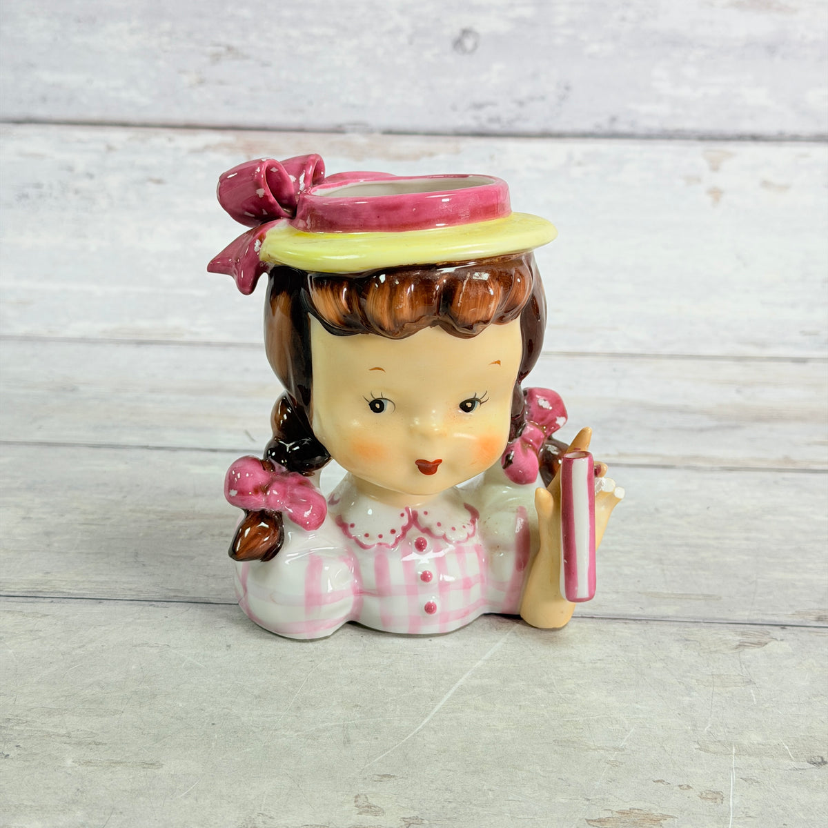 Front of child vase in pale pink checked blouse