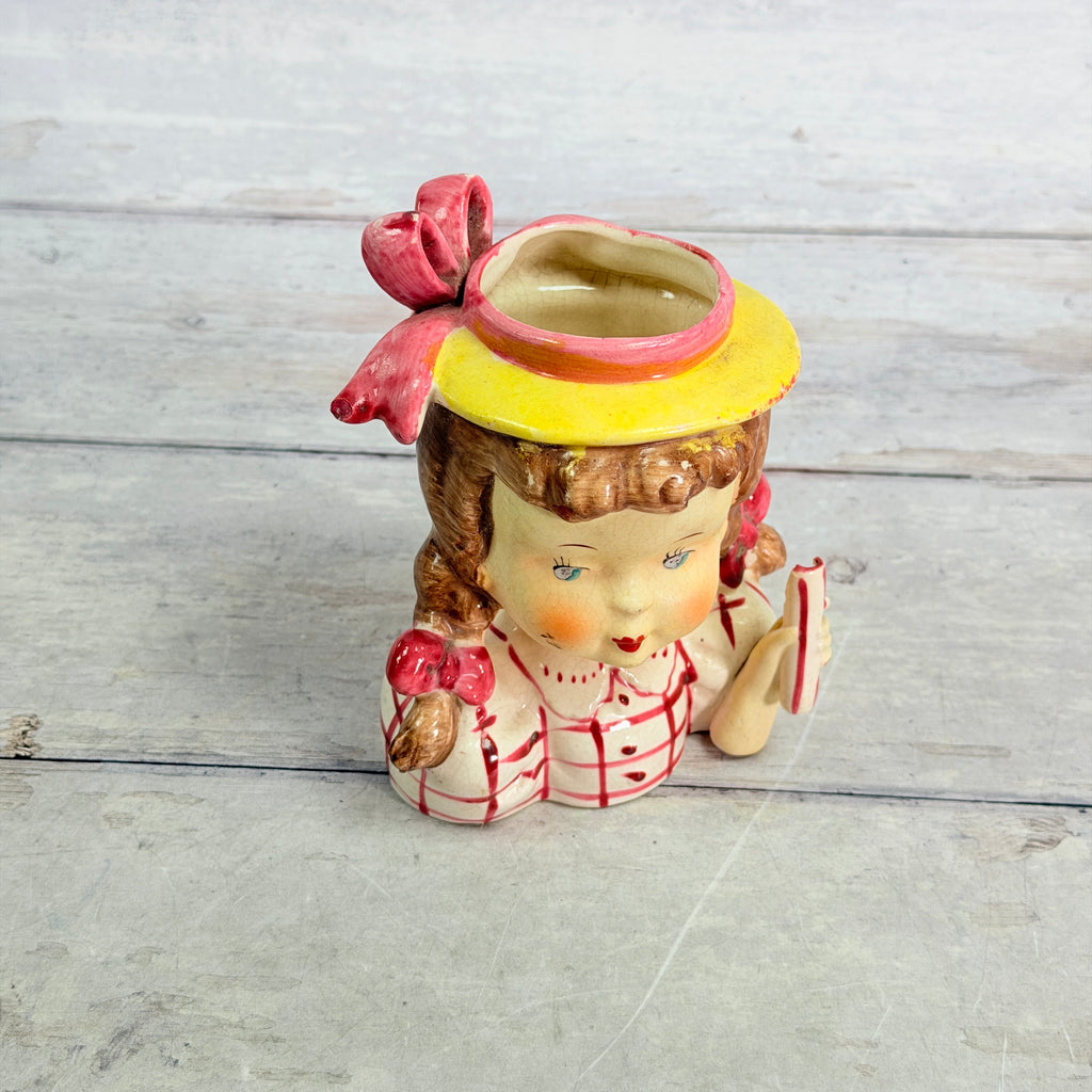 Top showing pink hat and opening