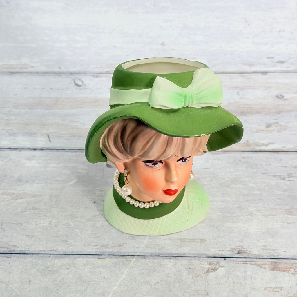 Top view showing green hat bow and opening
