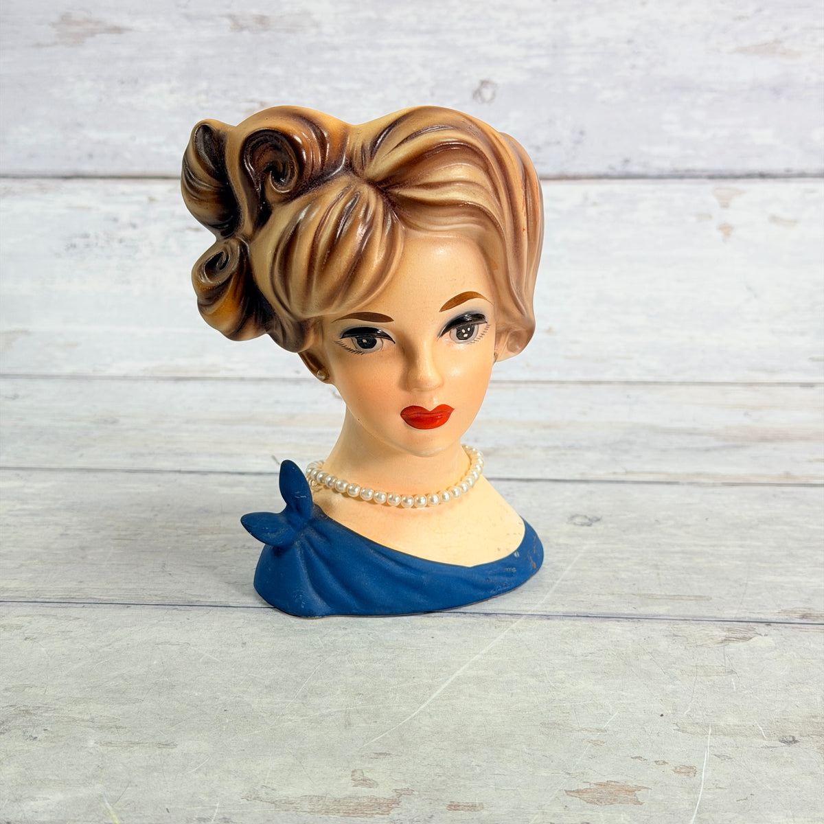 Front of Napcoware brown updo vase with blue side bow